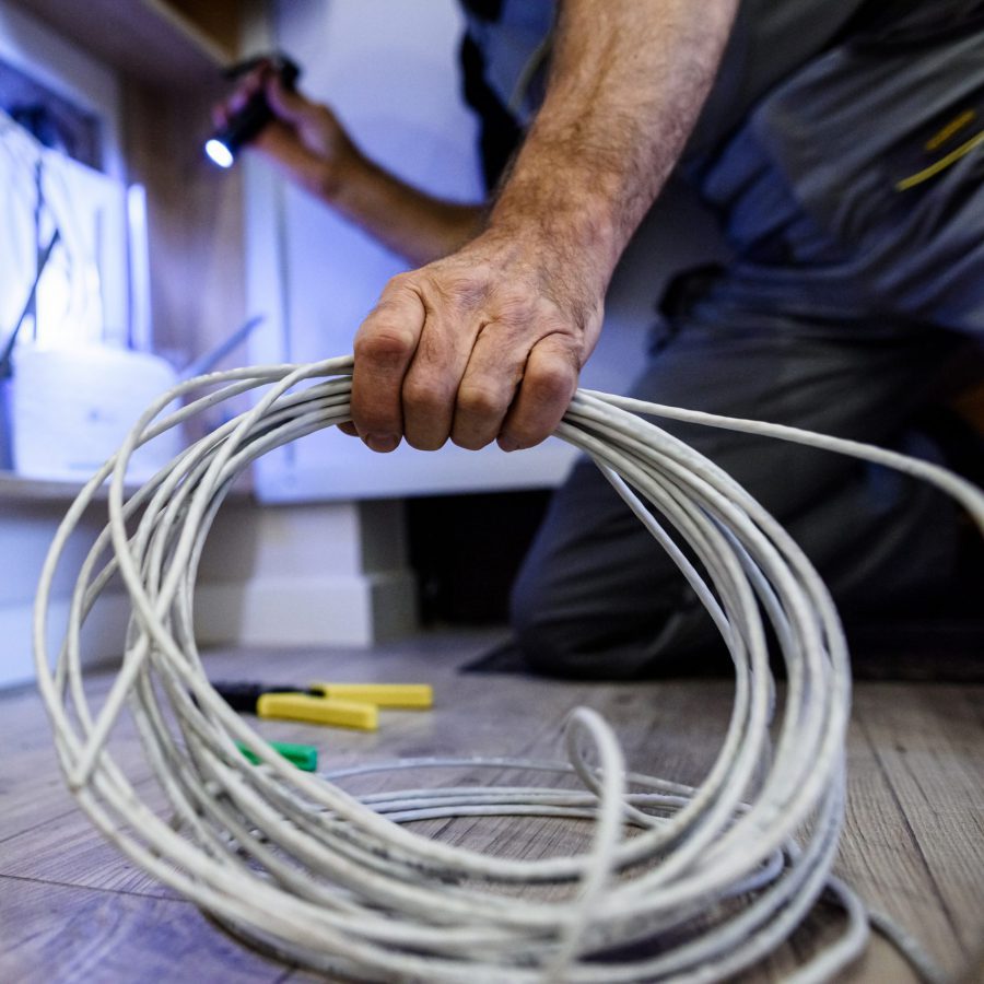 Cable repair person working on problem